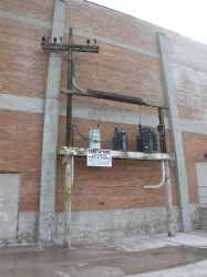 Utility pole and transformers on the north side of the Villa Theatre