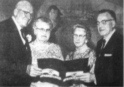 Gov. and Mrs. George D. Clyde, left discuss Cinerama with Elder Harold B. Lee of the council of the Twelve, Church of Jesus Christ of Latter-Day Saints, and Mrs. Lee during Riday preiere of the film at the Villa Theater.  The motion picture has started its regular run.