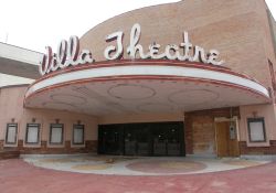 The front of the Villa Theatre. The pink paint is being removed from the Villa's exterior walls.